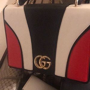 It is Gucci black leather